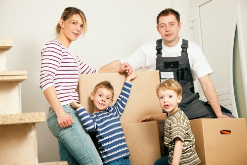 Local movers carrying boxes and furniture for a fast Lewisham move