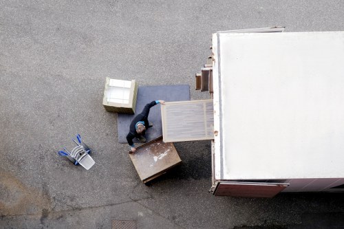 Removal van and moving team in a Lewisham residential street