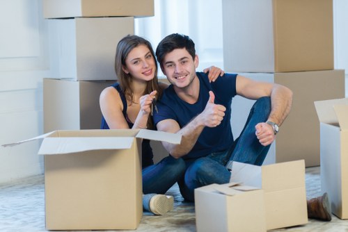 Packed moving boxes and furniture in a local Lewisham home