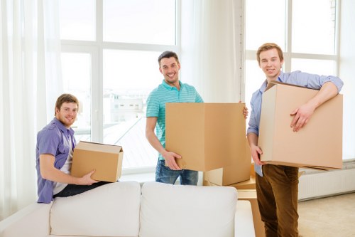 Furniture being carried through a typical Lewisham home entrance