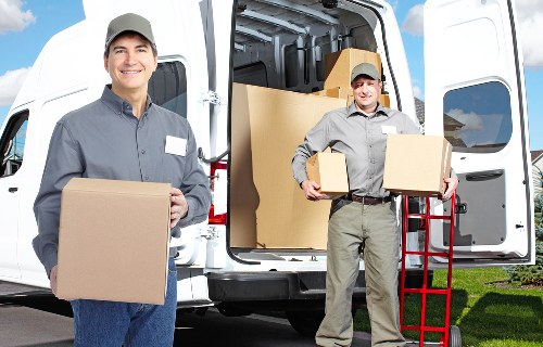 Packed boxes and household items loaded into a removal van